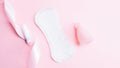 Menstrual cup, tampon, woman cup for sanitary protection. Pink ribbon with menstrual cup. Menstruation feminine period