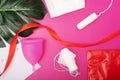 Menstrual cycle, calendar of bleeding periods during menstruation and hygiene for women, pads and tampons,cup on a pink background