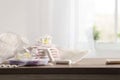 Menstrual hygiene products and wooden table in room front view