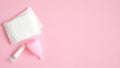 Menstrual hygiene products top view. Flat lay menstrual cup, sanitary pads, tampon on pink background with copy space. Women Royalty Free Stock Photo