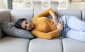 Menstrual Pain. Young Indian Woman Suffering From Acute Abdominal Ache At Home Royalty Free Stock Photo