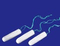 Menstrual period concept. Woman hygiene protection. Cotton tampons on black background