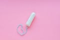 Menstrual period concept. Woman hygiene protection. Cotton tampons on pink background. Top view, flat lay