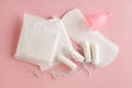 Feminine hygiene and protection products, sanitary pads, tampons and menstrual cup on pastel pink background, top view, flat layou Royalty Free Stock Photo
