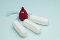 Menstruation sanitary soft cotton tampon for woman hygiene protection and crochet funny blood drop. Woman critical days, gynecolog Royalty Free Stock Photo