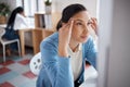 This mental block seems impenetrable. a young businesswoman looking stressed while using a laptop at her desk in a