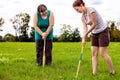 Mental disabled woman is playing crocket to train her motor abilities Royalty Free Stock Photo