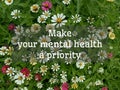 Inspirational motivational quote - Make your mental health a priority. Self love and care concept with top view of zinnia flowers.