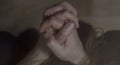 Mental health and depression photo. Close-up hands shrink from nerves. Toning, low key, selective focus Royalty Free Stock Photo