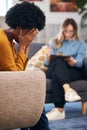 Mental health, stress and psychology with a black woman in therapy, talking to a professional. Anxiety, depression or Royalty Free Stock Photo