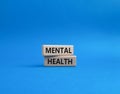 Mental Health symbol. Concept word Mental Health on wooden blocks. Beautiful blue background. Psychology and Mental Health concept Royalty Free Stock Photo