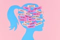 Mental load concept with woman`s head silhouette with multiple tasks on notes