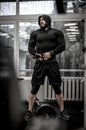 Mental and physical growth concept of hard workout training in gym by strong young athlete caucasian man wearing hoodie and Royalty Free Stock Photo