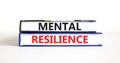 Mental resilience symbol. Concept word Mental resilience typed on books. Beautiful white table white background. Business