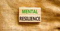 Mental resilience symbol. Concept word Mental resilience typed on wooden blocks. Beautiful canvas table canvas background.