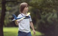 Mentally Challenged Boy Launching a Toy Airplane