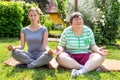 Mentally disabled woman and coach is doing yoga exercises Royalty Free Stock Photo