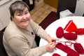 mentally disabled woman is crocheting, handiwork for a alternative therapy Royalty Free Stock Photo