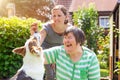 Mentally disabled woman with a second woman and a companion dog Royalty Free Stock Photo