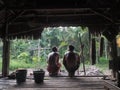 Mentawai mens sitting in jungle house