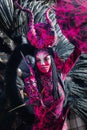 Menton, France-February 12, 2023: Close up woman dressed colorful pink fantastic carnival costume