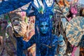 Menton, France-February 12, 2023: Unidentified woman dressed colorful blu carnival costume