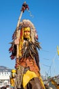 Menton, France-February 12, 2023: Unidentified woman dressed colorful carnival costume red indian.