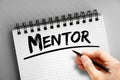Mentor text on notepad, concept background Royalty Free Stock Photo