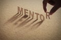 MENTOR wood word on compressed board Royalty Free Stock Photo