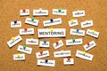 Mentoring from cutout newspaper headlines pinned to cork bulletin board Royalty Free Stock Photo