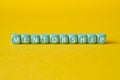 Mentorship - word concept on building blocks, text