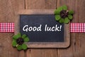 Menu board with clovers and good luck message with wood Royalty Free Stock Photo