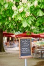 Menu on board in French outdoor restaurant Royalty Free Stock Photo