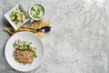 Menu business lunch restaurant, beef Stroganoff, green salad and chicken soup. Gray background, top view Royalty Free Stock Photo