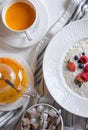 Menu at the cafe, Breakfast, Porridge with berries, Bulgur with coconut milk. Flatlay, Top view, Moody on black background,