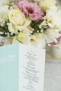 Menu card with beautiful flowers on table in wedding day Royalty Free Stock Photo