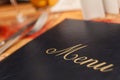 Menu & Cutlery on A Restaurant Table Royalty Free Stock Photo