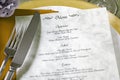 Menu and cutlery on restaurant table