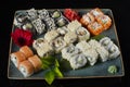 Menu of the Japanese restaurant. Several sushi laid out on a plate with ginger sauce wasabi. Rolls from above Royalty Free Stock Photo