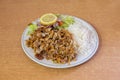 Menu mixed kebab dish garnished with basmati rice and salad with red onion