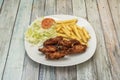 Menu plate fried chicken wings with salad and tomato