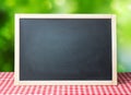 Menu recipe blackboard desorated picnic cloth. Royalty Free Stock Photo