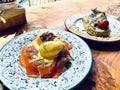 Salmon eggs Benedict, and vanilla-flavored bread with poached eggs and fennel leaves