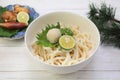 Japanese udon dishes sprinkling soup stock to noodles directly