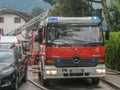 Merano, italy, 16/09/2020 fearless firefighters engaged in operation with ladder trucks and fire trucks