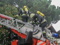 Merano, italy, 16/09/2020 fearless firefighters engaged in operation with ladder trucks and fire trucks