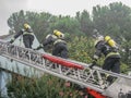 Merano, italy, 16/09/2020 fearless firefighters engaged in operation with ladder trucks and fire trucks