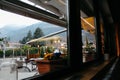 Merano, Italy - 03 20 2013: restaurant interior, flowers by the window