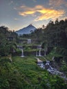 Merapi mountain view from Mangunsuko bridge, Magelang Indonesia. Sunrise with forest scenery, dam and Mountain