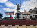 the slogan and logo of the XX Papua PON 2021 installed against the background of the ANIM-HA statue